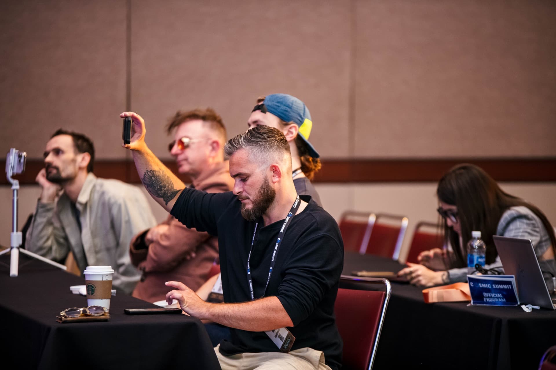 Cosmic Summit attendees in the audience, engaged with the stage