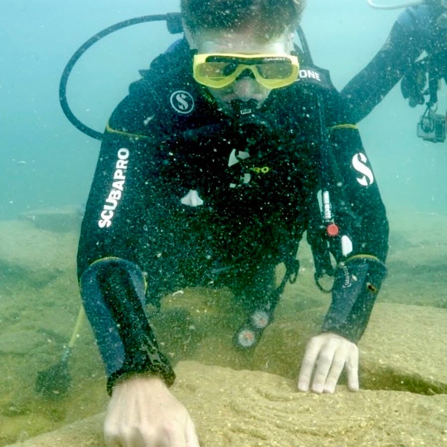 Matthew LaCroix diving at a submerged site